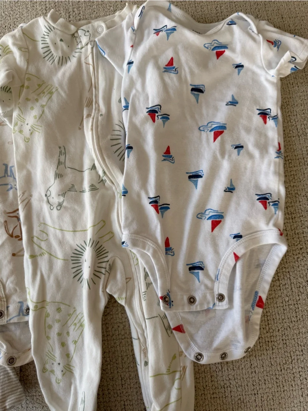 Carter's Baby onesie bundle- White with Blue, Red, Green & Tan Prints